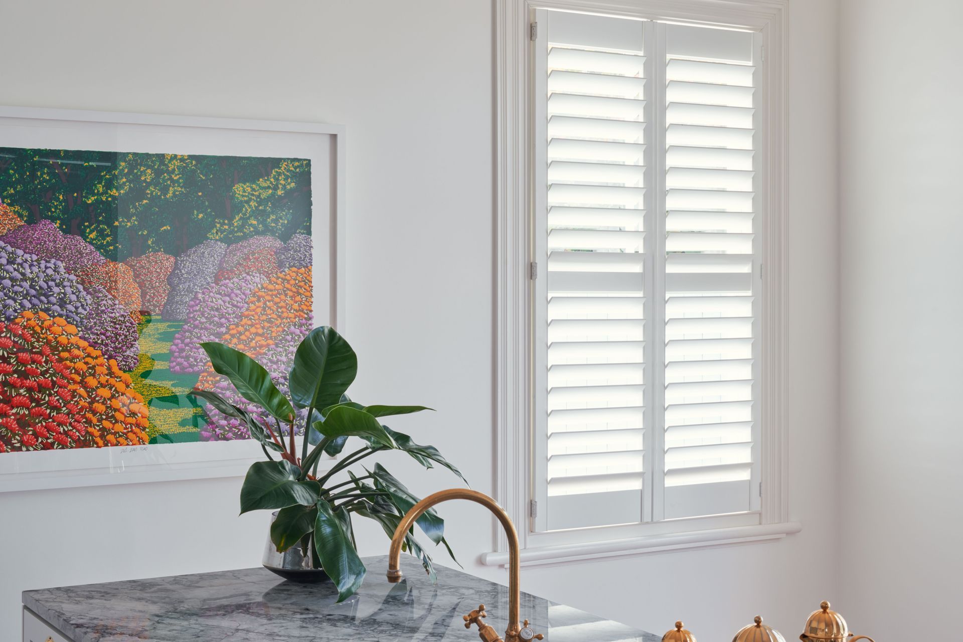 Shutters offer a minimalist aesthetic while adding a textural quality.