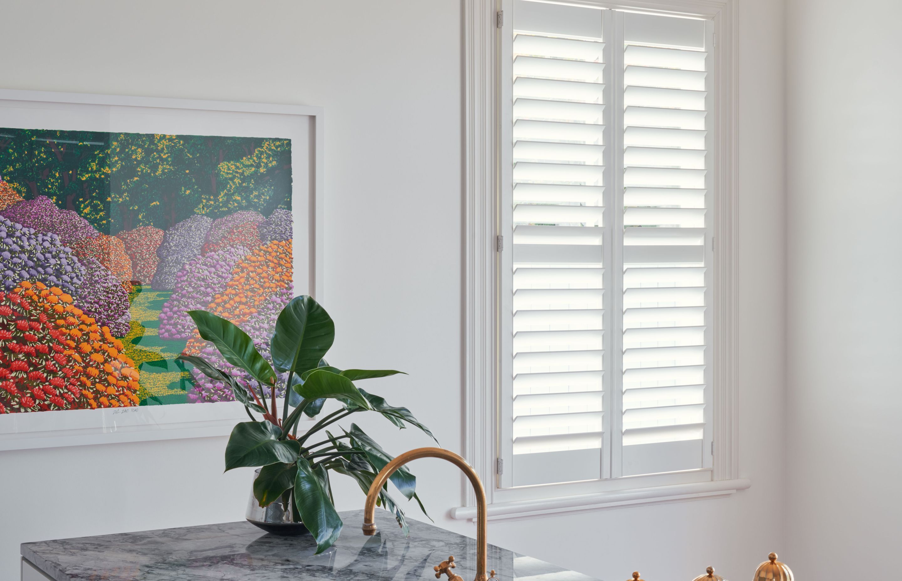 Shutters offer a minimalist aesthetic while adding a textural quality.