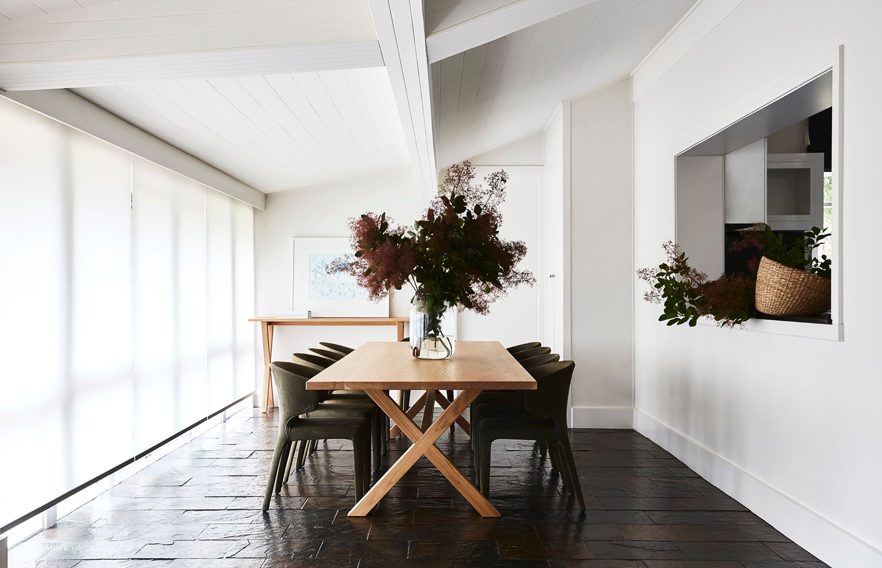 A central dining table and plenty of space between each chair are imperative to effective dining room design.