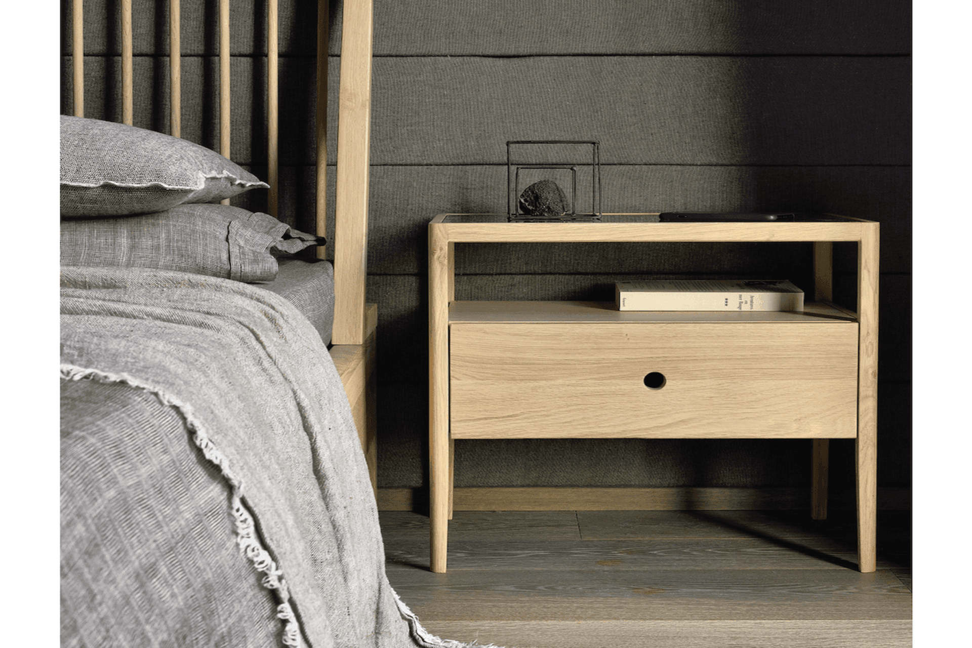 A bedside table with optimum bedside storage space can hold fun and practical household items. Featured product: Spindle Bedside Table.
