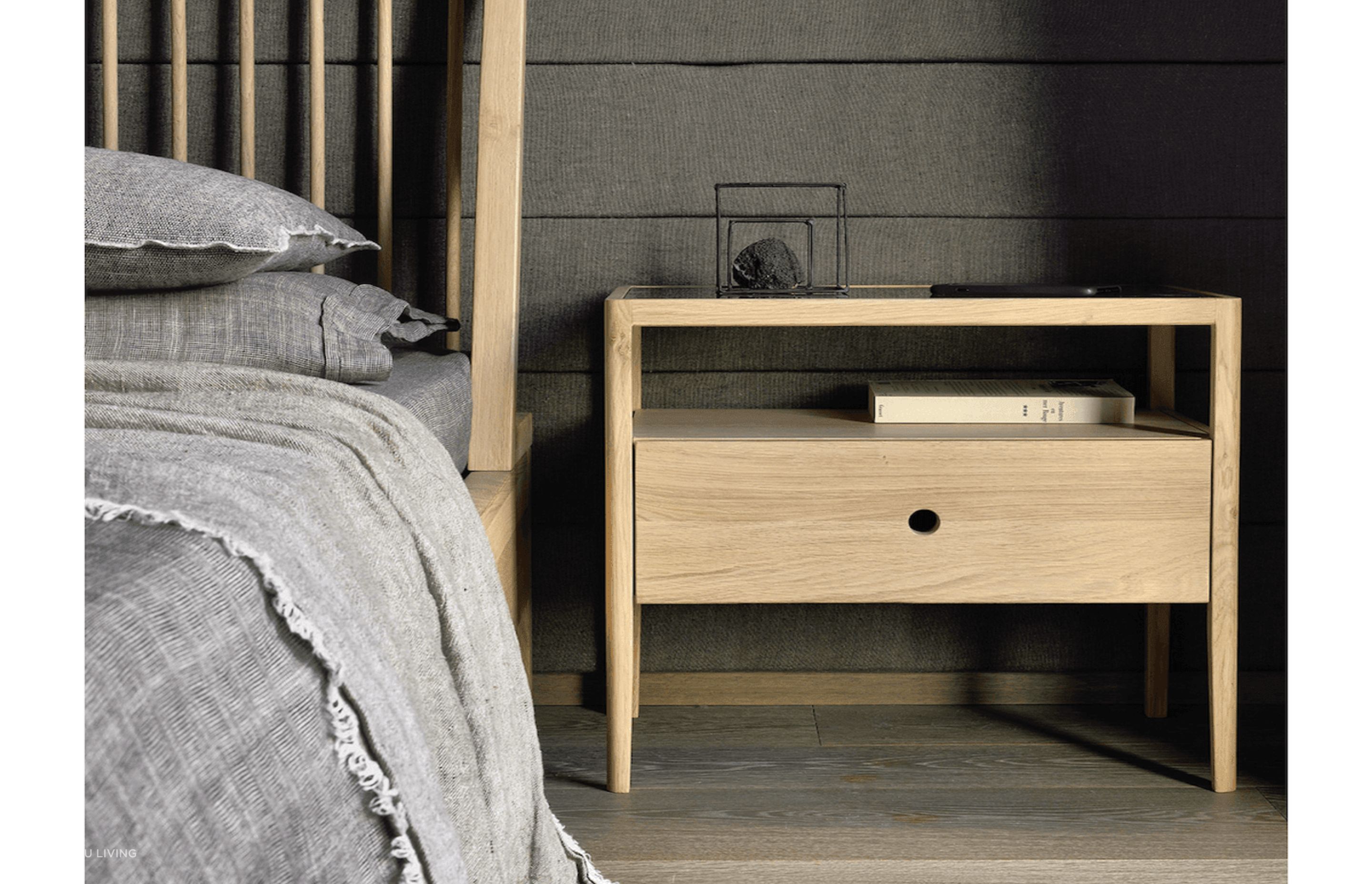 A bedside table with optimum bedside storage space can hold fun and practical household items. Featured product: Spindle Bedside Table.