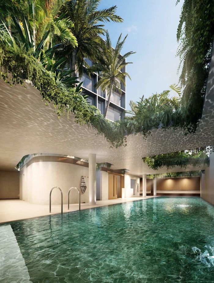 The pavilions above the semi-covered indoor/outdoor pool are planted with greenery that will drape down over the pool.