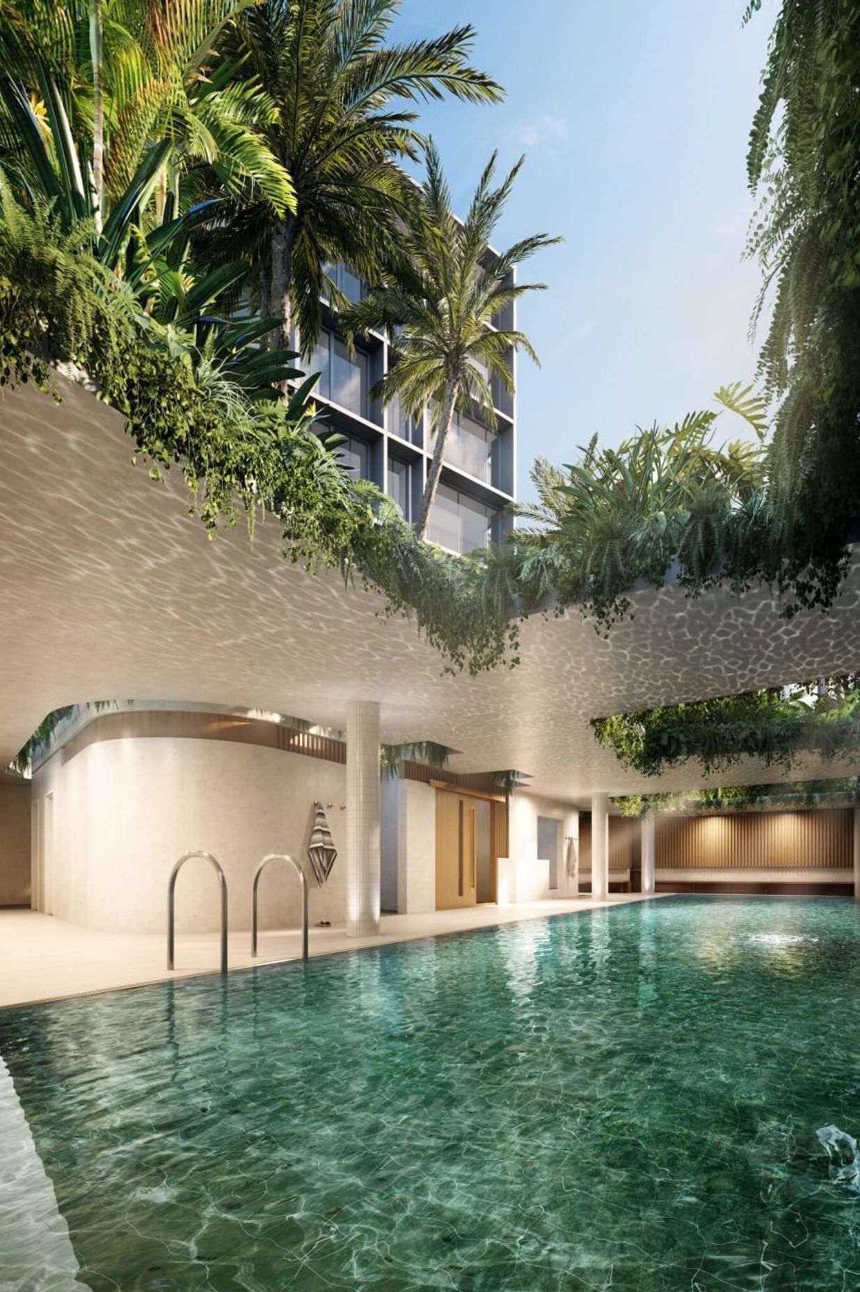 The pavilions above the semi-covered indoor/outdoor pool are planted with greenery that will drape down over the pool.