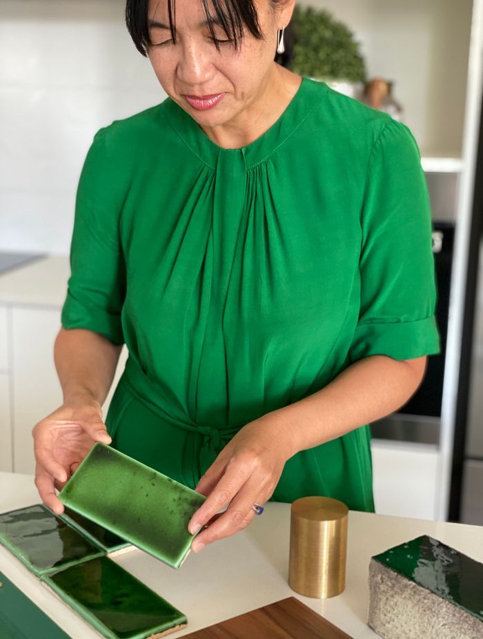 Head Architect Tania Wong lays out material samples inspired by the vast landscape of Tāmaki Makaurau.