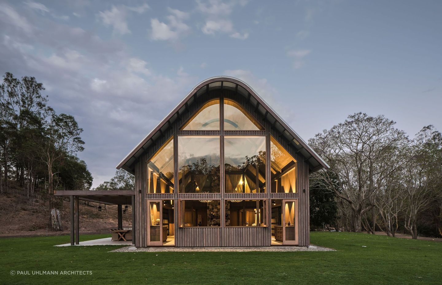 Barn style homes often have gambrel roofs, mimicking a traditional barn. Photographer: Amy Macpherson Studio.