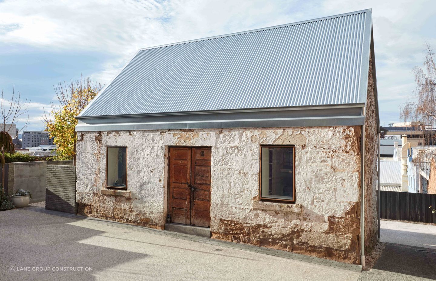 As much of the original stonework as possible was retained in the renovation. Photography: Sean Fennessey Photography.