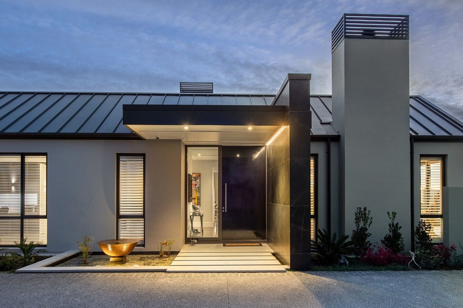 Designer flair with the combined use of downlights and LED strip lights in this family home north of Auckland