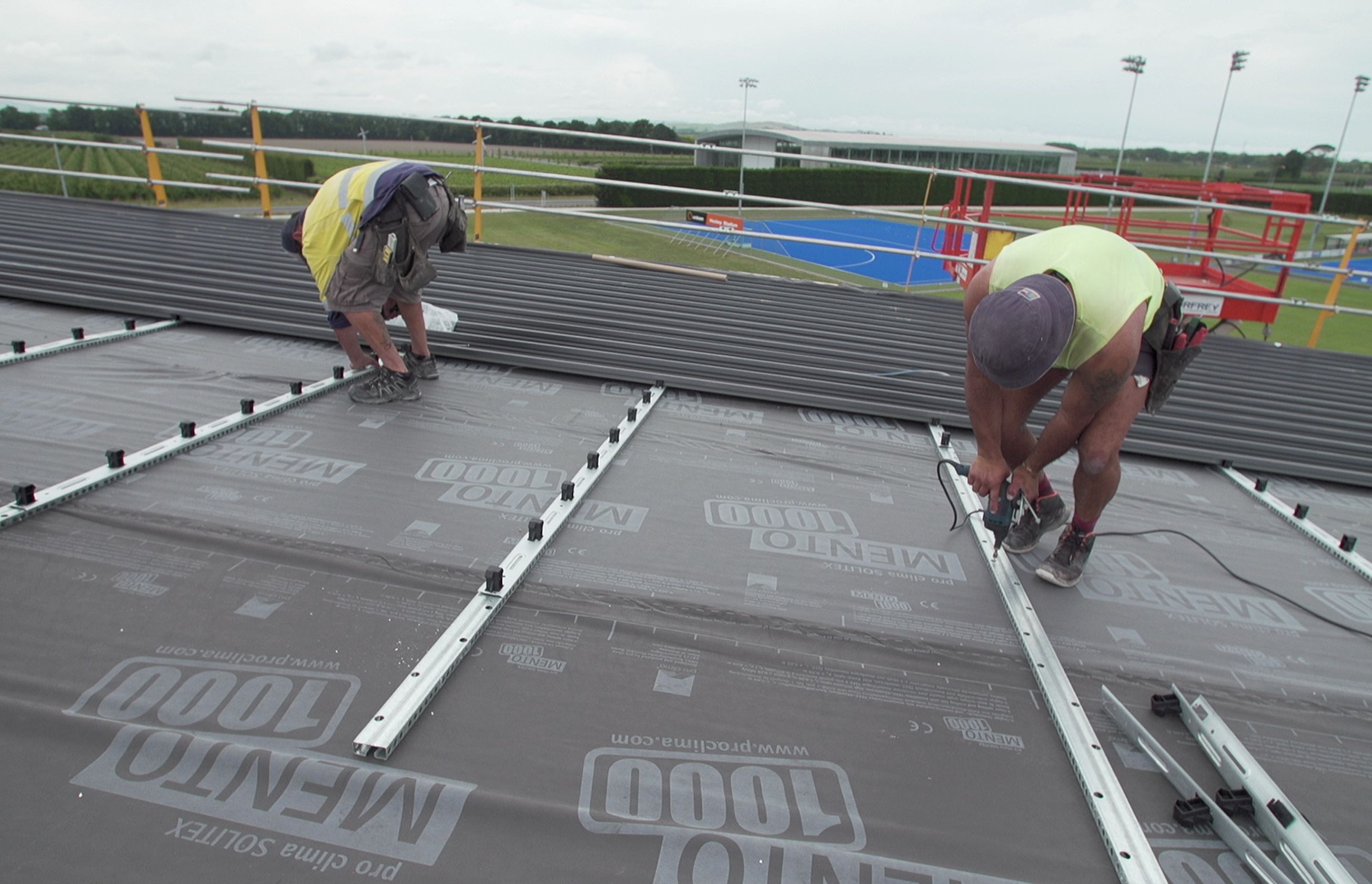 The Tricore Roofing System comprises a pre-finished lining sheet, perforated roof rail, underlay and top sheet.