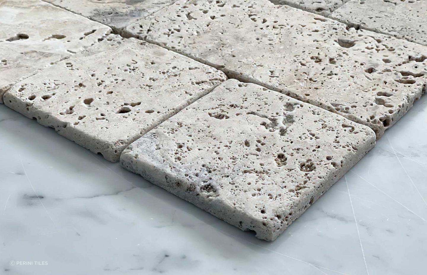 Travertine tiles are often used as a pool surround tile as they offer incredible slip resistance in these sorts of applications. Our Tumbler travertine tile collection is available in a selection of rich and earthy tones. Combining classic square tiles and subway tiles, Tumbler offers a unique sense of pattern that is ideal for complementing your home’s outdoor areas.