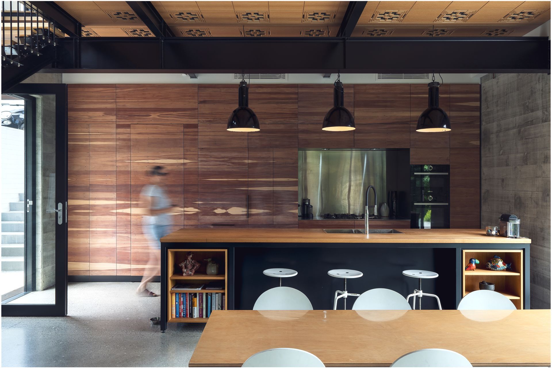 “All this cabinetry is made from the floorboards of the original house. Our cabinetmaker split it so that it's thinner. They set it up in their factory and played with all the pieces to get this really lovely, finished geometry.” A hidden door in the kitchen leads to the master bedroom. “I've always been fascinated by the whole idea of secret doors and the idea that things are happening beyond the obvious."