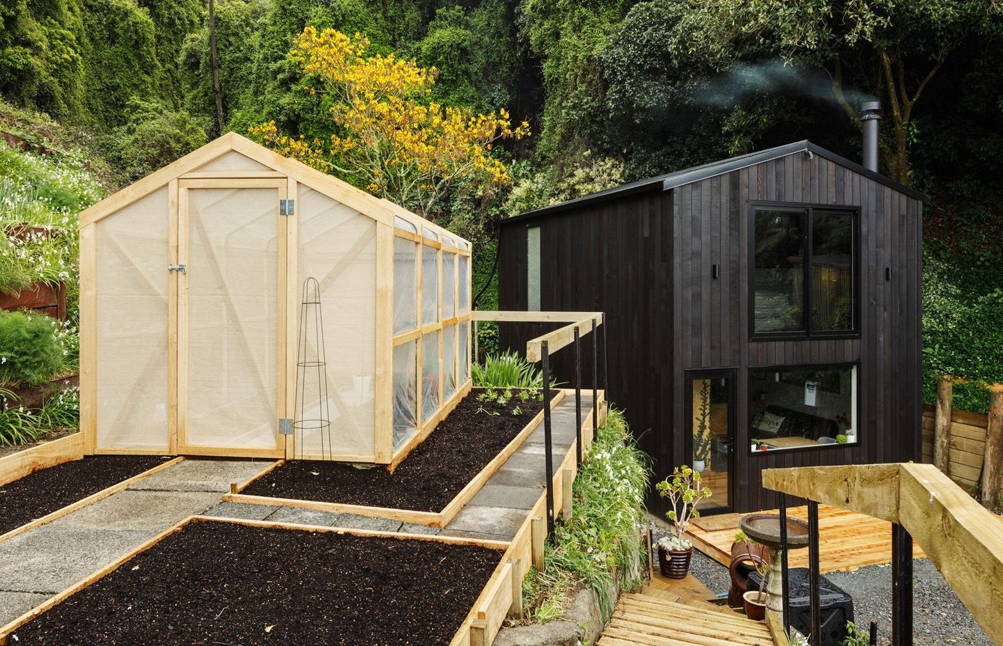 One of a new breed of modest but well-designed New Zealand homes, this 64m² tiny house is occupied by builder Rhys Doesburg and his family while he plans a larger house on this infill site in Wellington. Photograph by Andre Vroon.