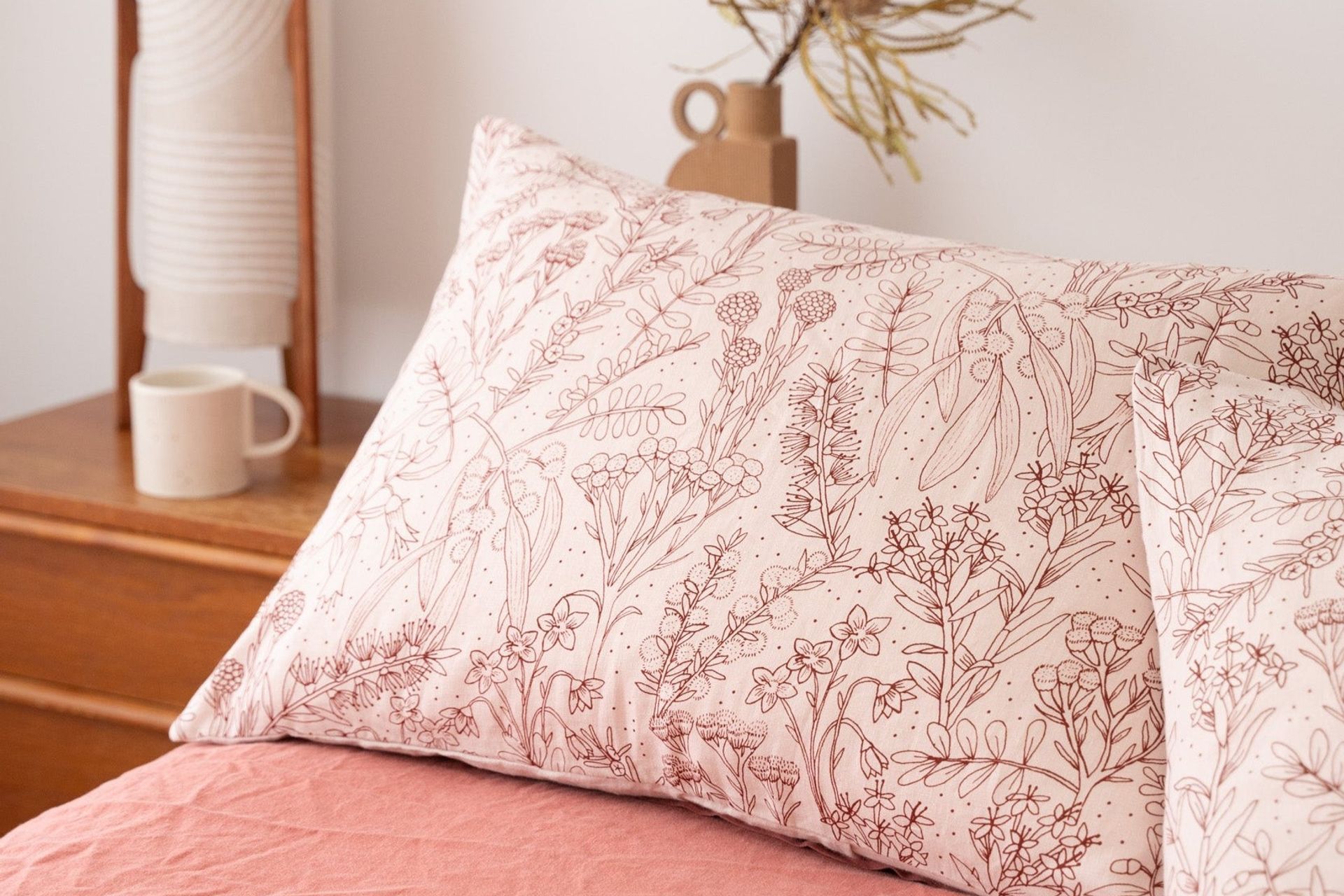 Pillows each have their own upkeep requirements but will last longer with a high-quality pillow protector or pillow case, ideally one as gorgeous as this Merri Creek in Blush design