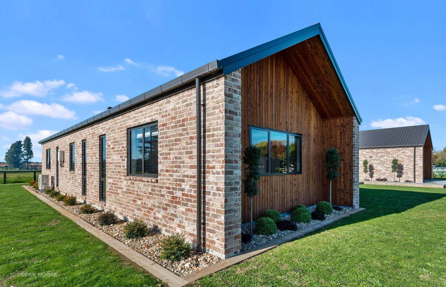 The Austral bricks from The Brickery are manufactured to look aged, a look that references reclaimed bricks from the Christchurch earthquakes that are no longer easy to find. The extended walls at the gable end provided room for extra planting.