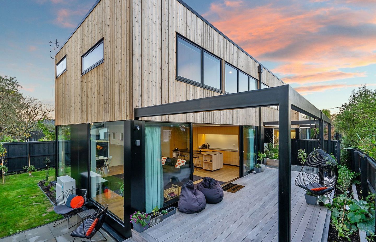 A great example of vertically aligned wood cladding using JSC Rustic Cedar.