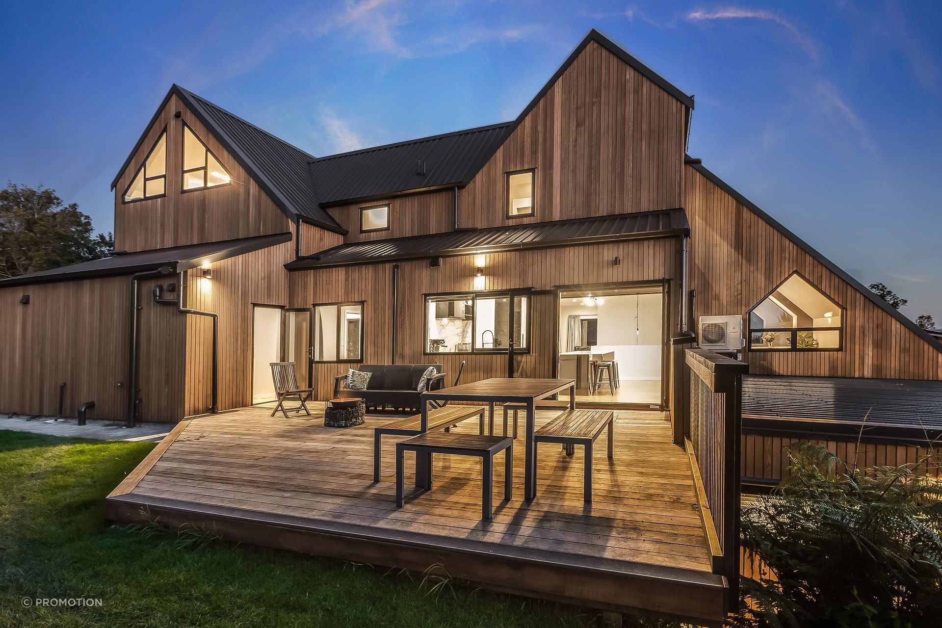 Exterior lighting was planned to highlight the home’s cedar cladding.
