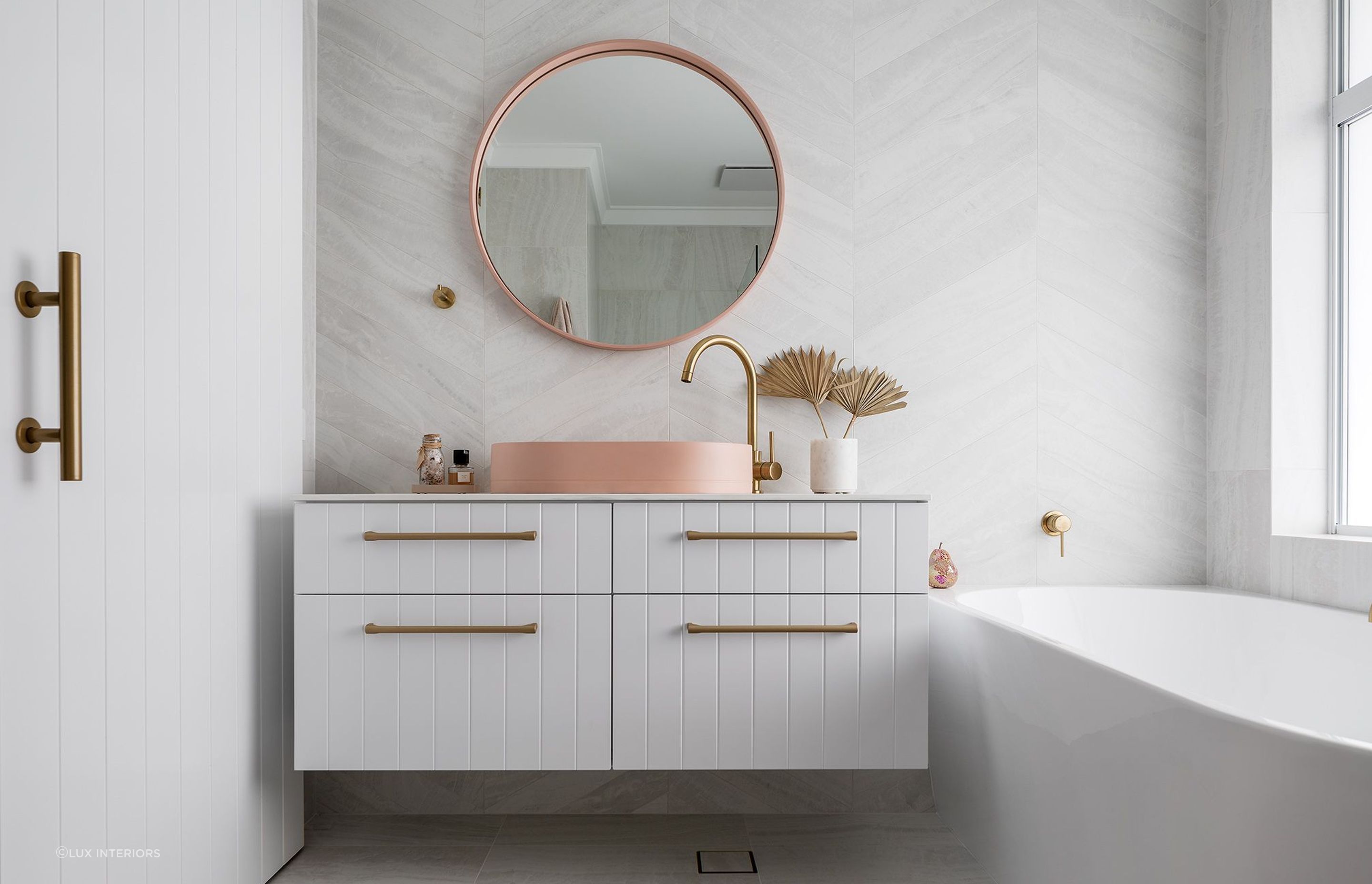 Matching the material and style of your bathroom mirror and sink creates a uniform look. Featured project: Sholl Project - Bathroom