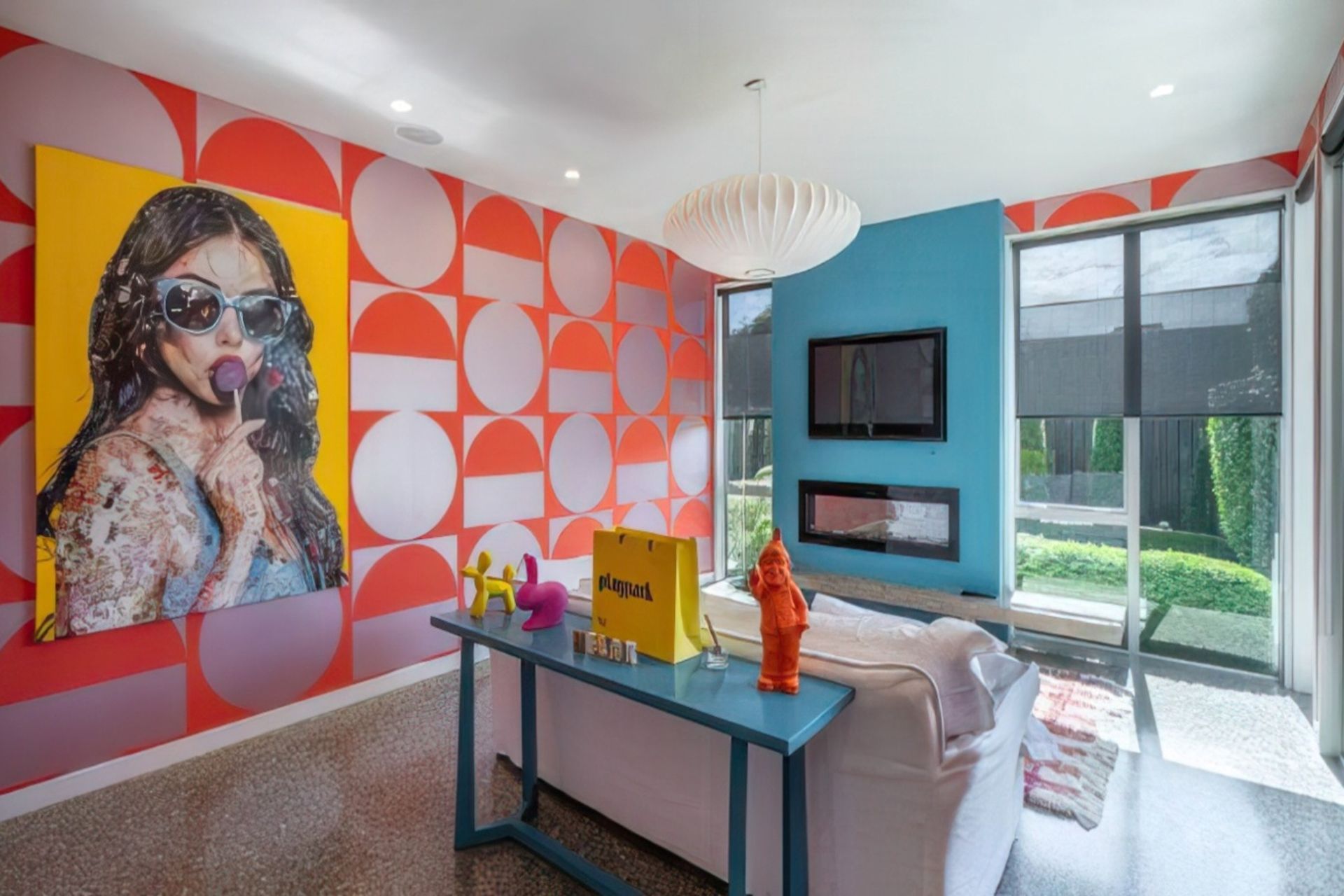 The sunny adult’s retreat can be separated from the main living area, but echoes the colours.