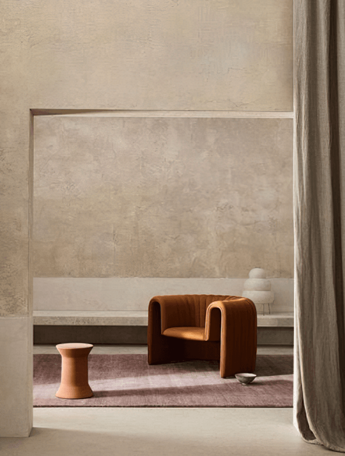 Image Credit:  Armadillo | Warm neutral walls in venetian plaster + organic furniture forms