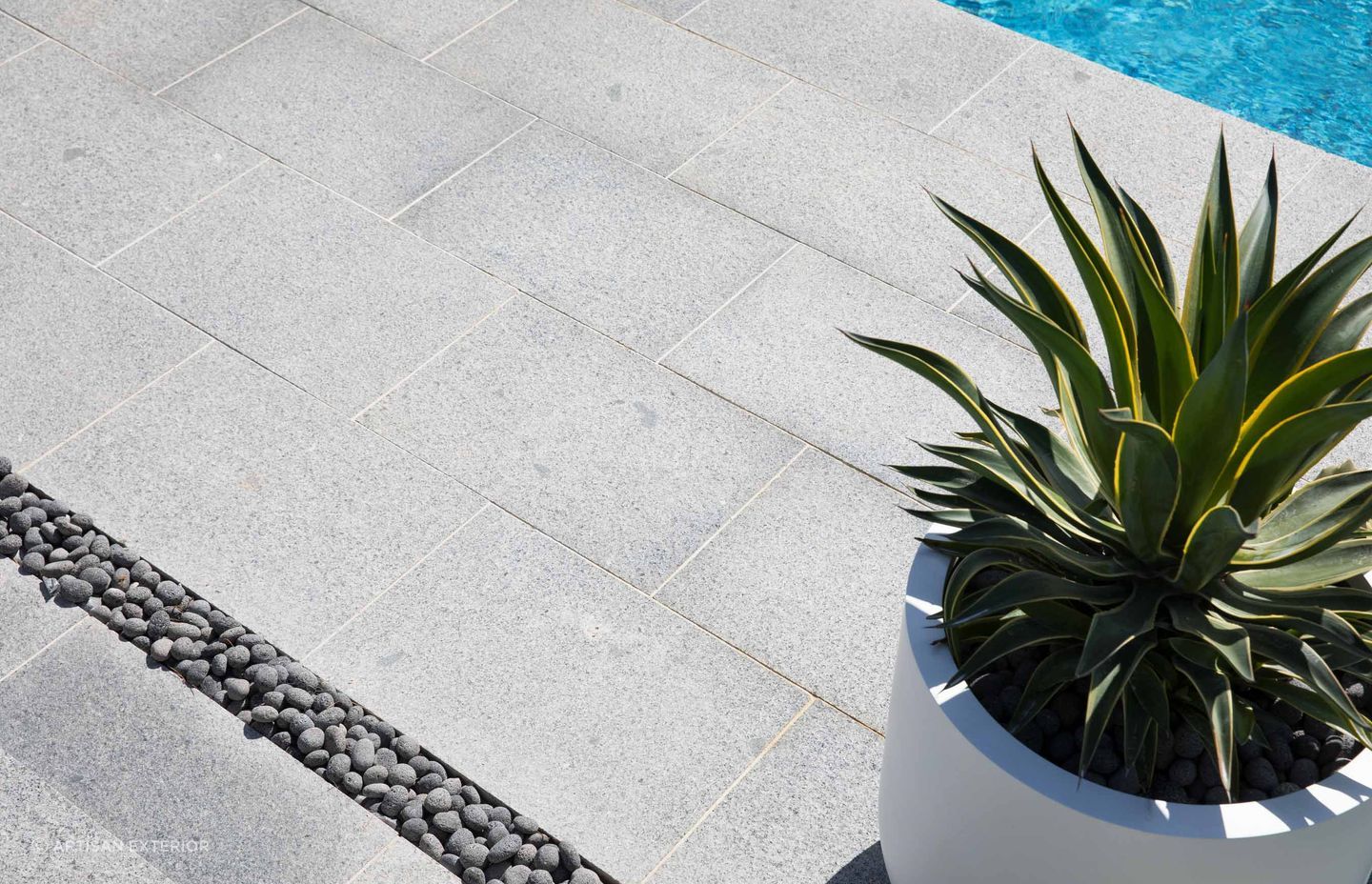 Granite slabs can be used in conjunction with pebbles.