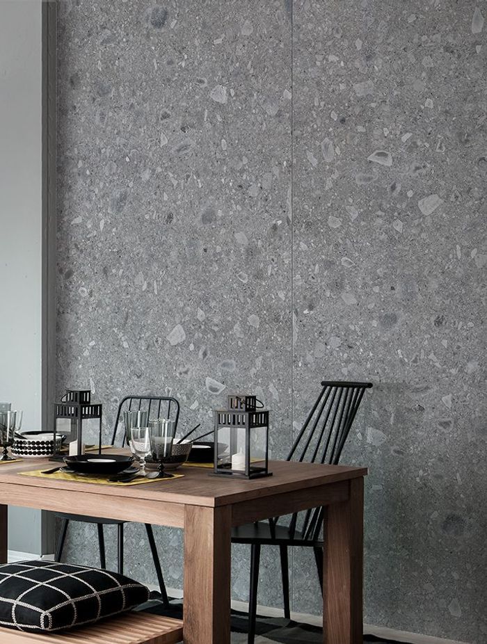 A grey porcelain tile wall with unique patterns.