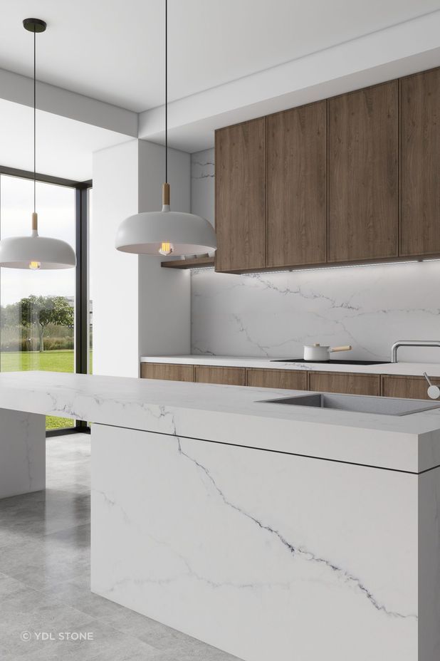 Engineered stone gives this kitchen a very clean appearance.