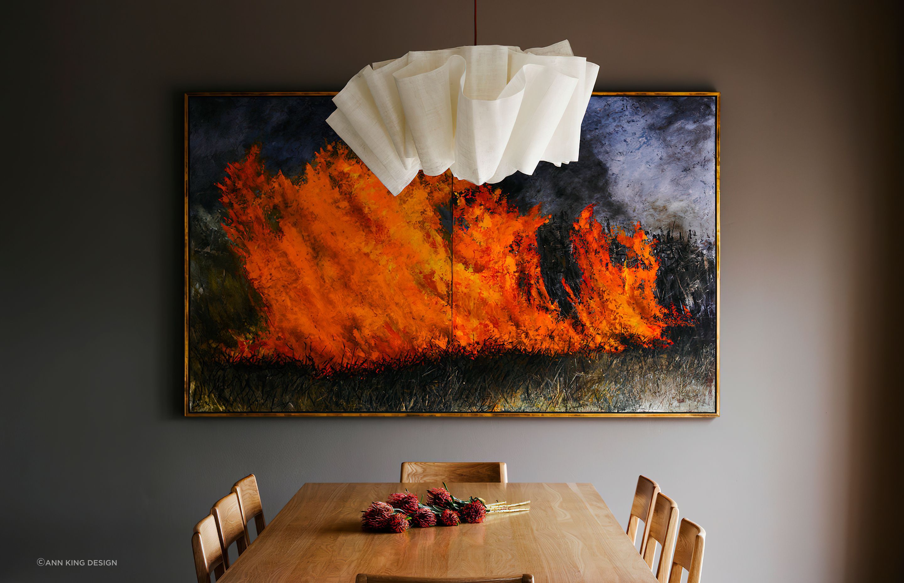 Striking wall art can brath life and emotion into a dining room.