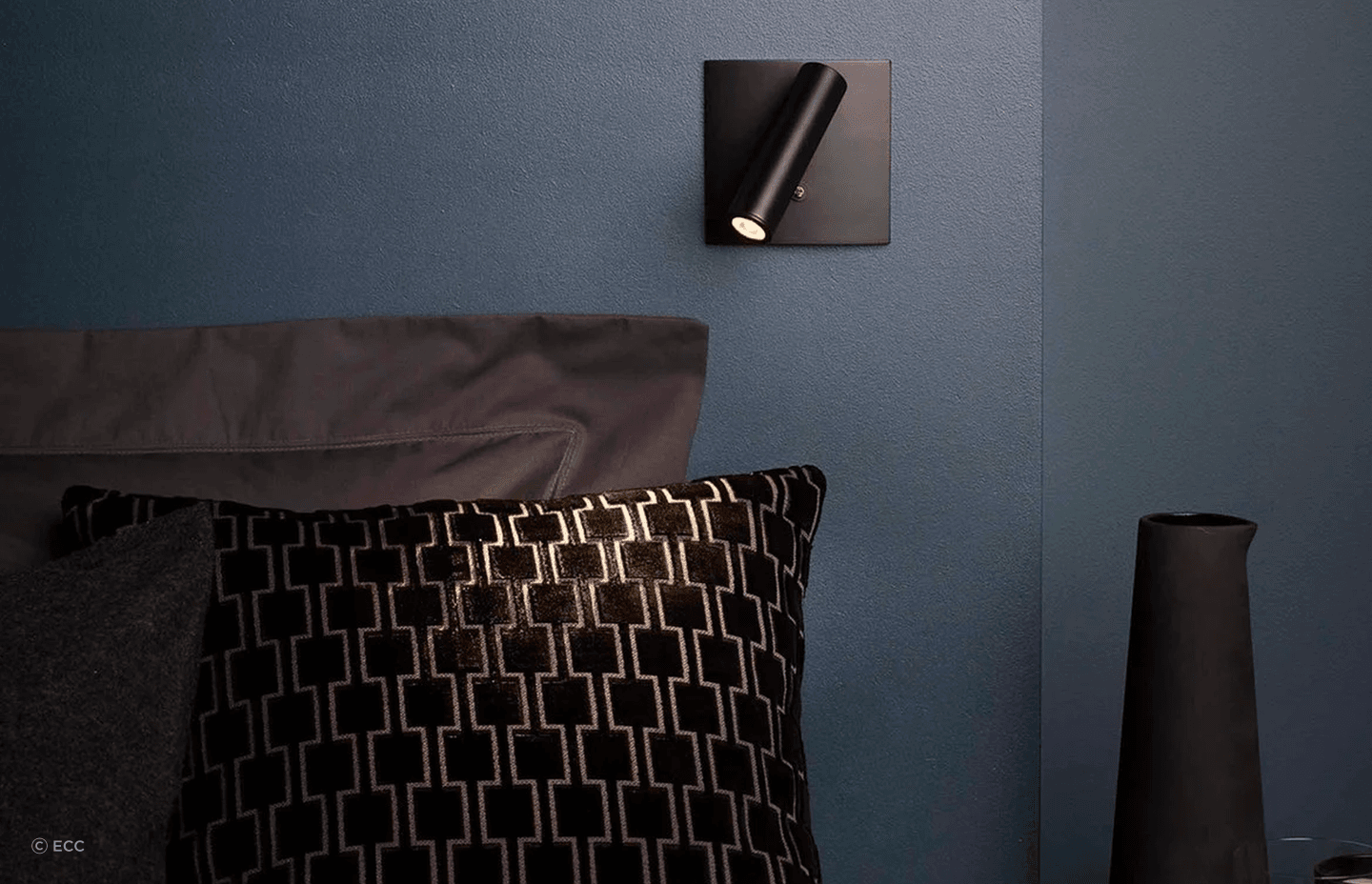 The Enna Square offers directional illumination for reading while making a distinct contribution to a bedroom.