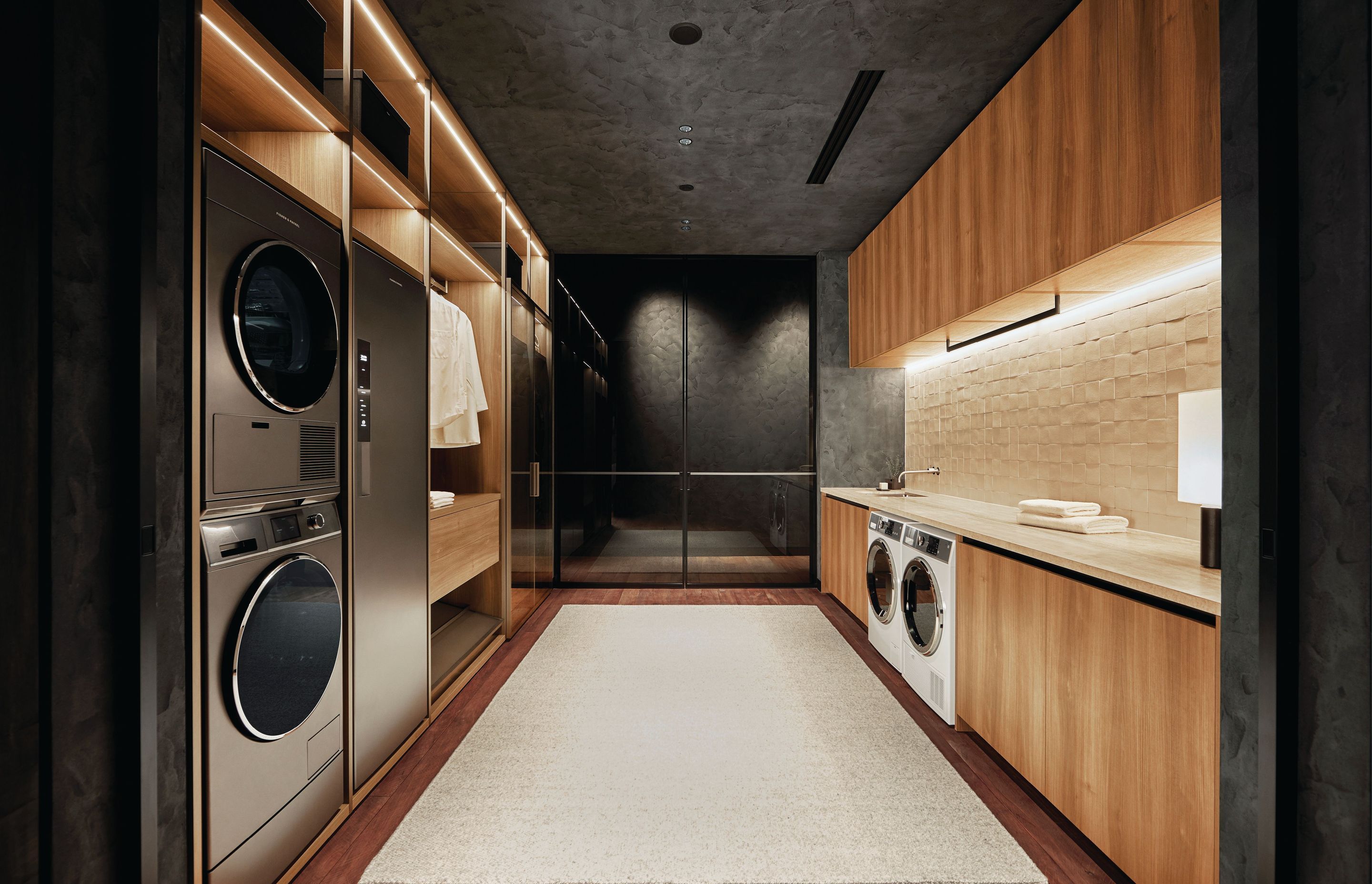 Designed by Boffi, this laundry and wardrobe area balances modern design and domestic functionality.