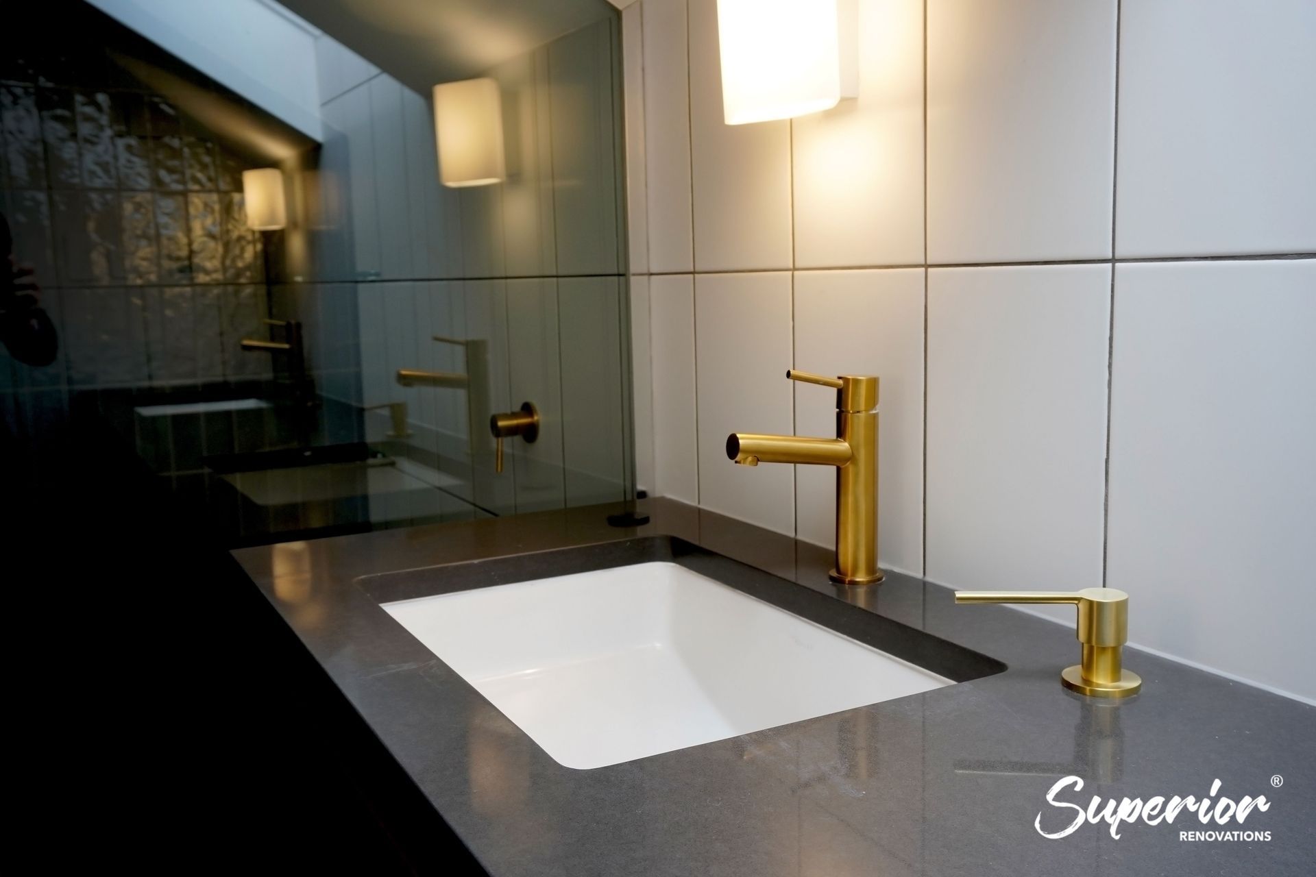 Gold fixtures used throughout the bathroom in Westmere