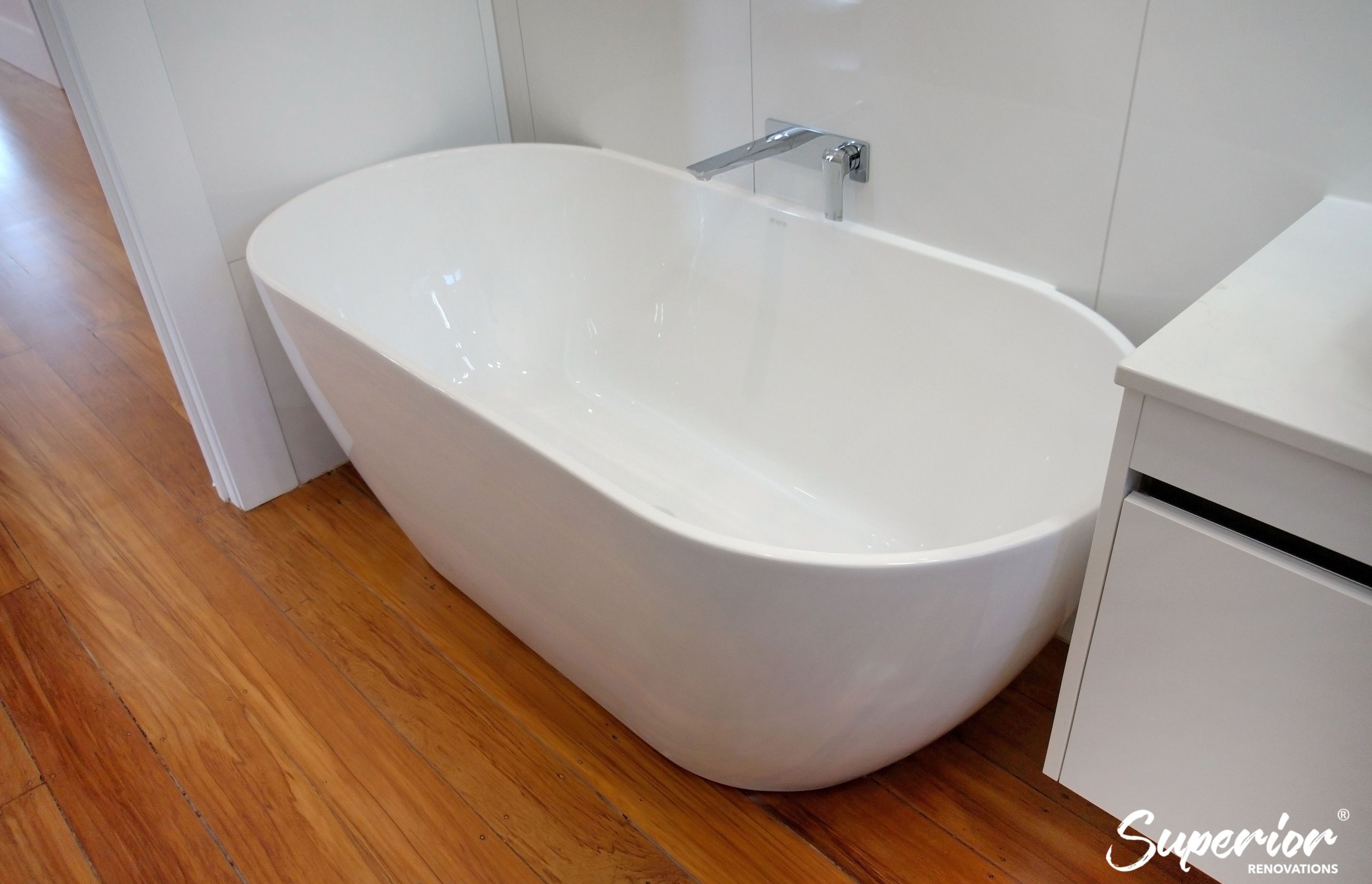 Oval shaped bath in Epsom which saves space