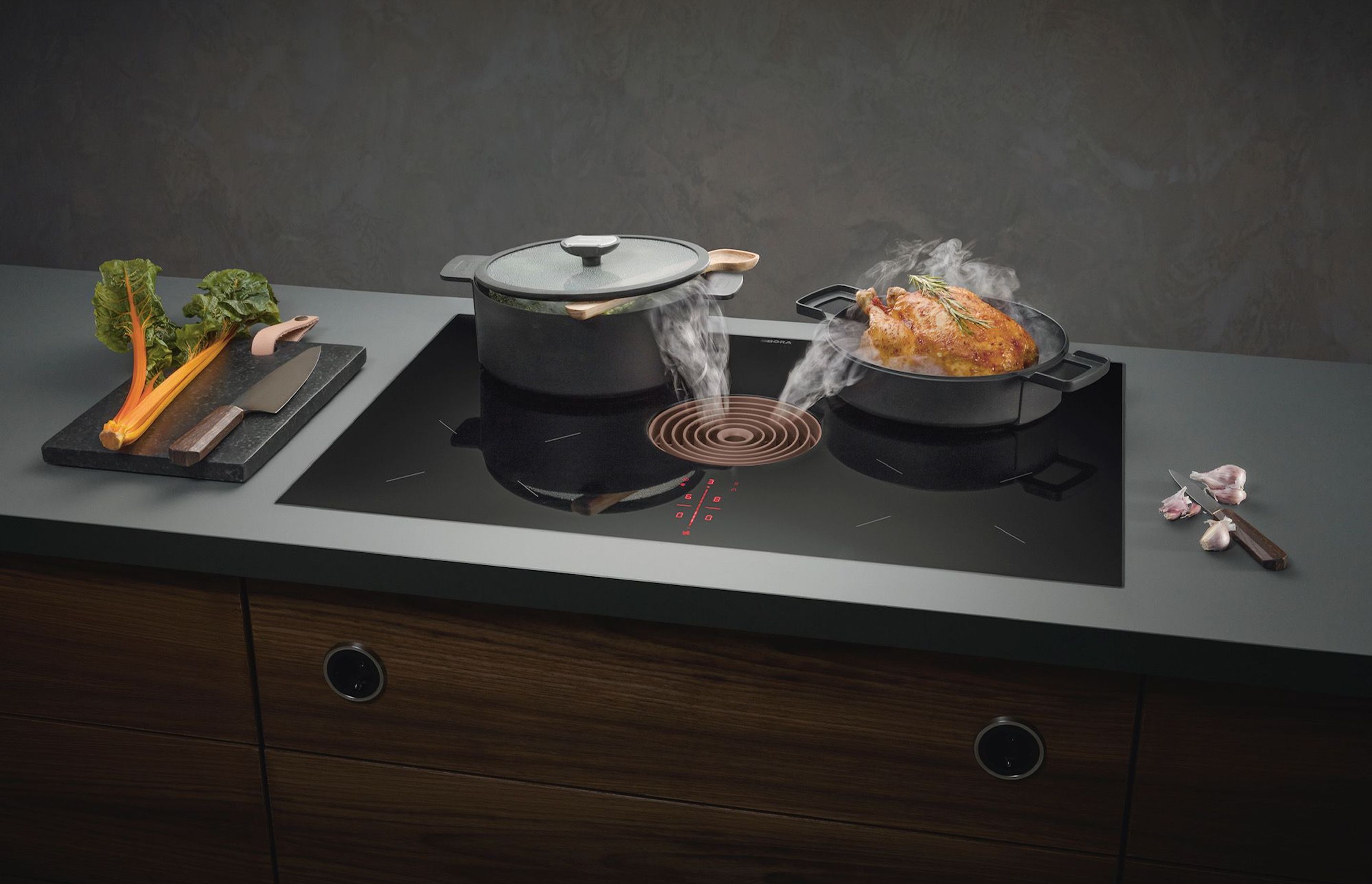 BORA Pure is the all-in-one cooktop, offering an induction cooking surface and built-in extractor.