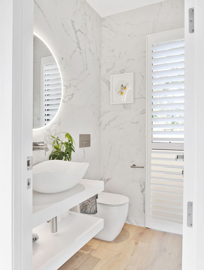 White finishes were installed in the bathroom for a clean, bright feel.