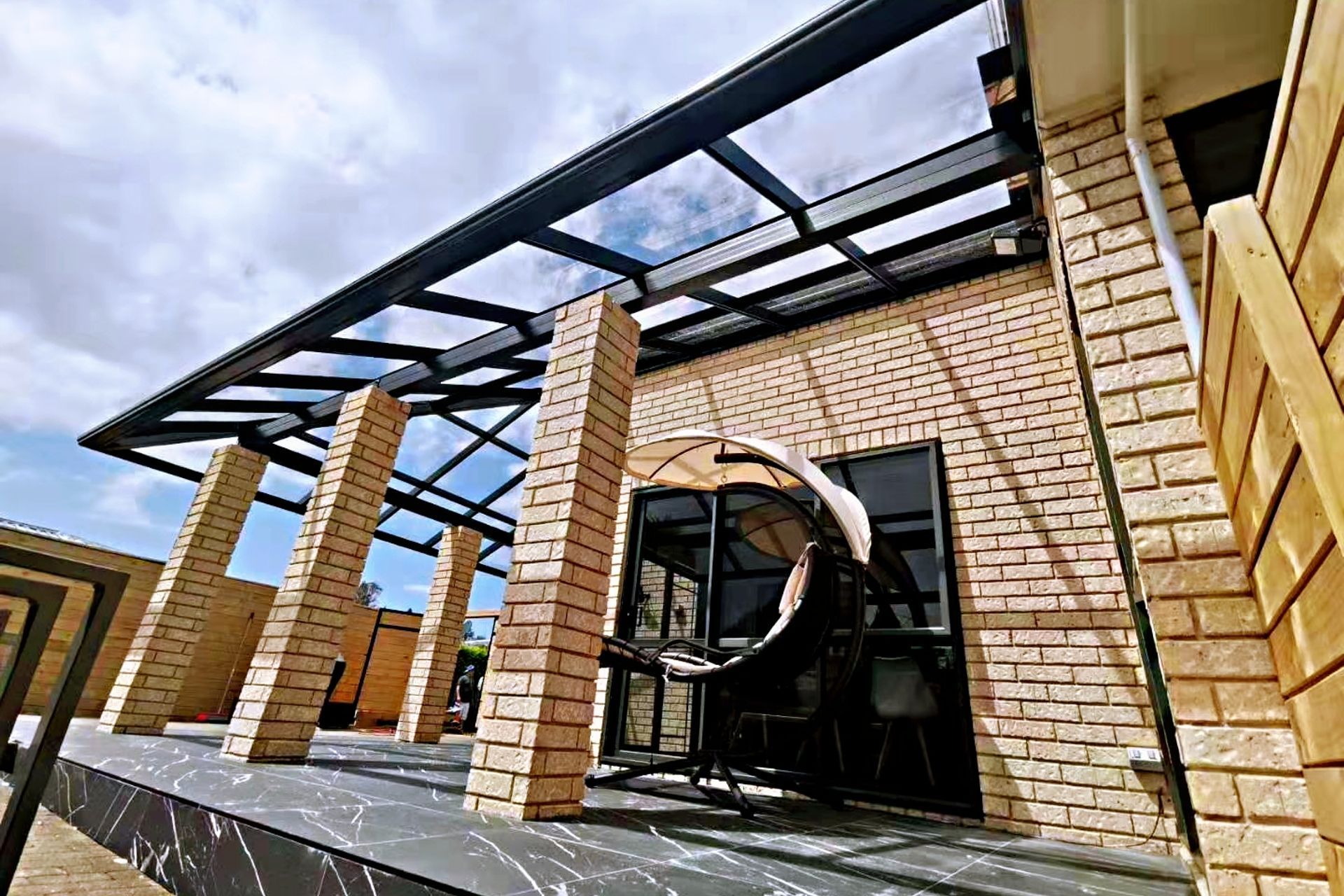 This Pergola we built so our clients could enjoy all kinds of weather and not just to provide shade and hence we used glass roofing for the pergola.