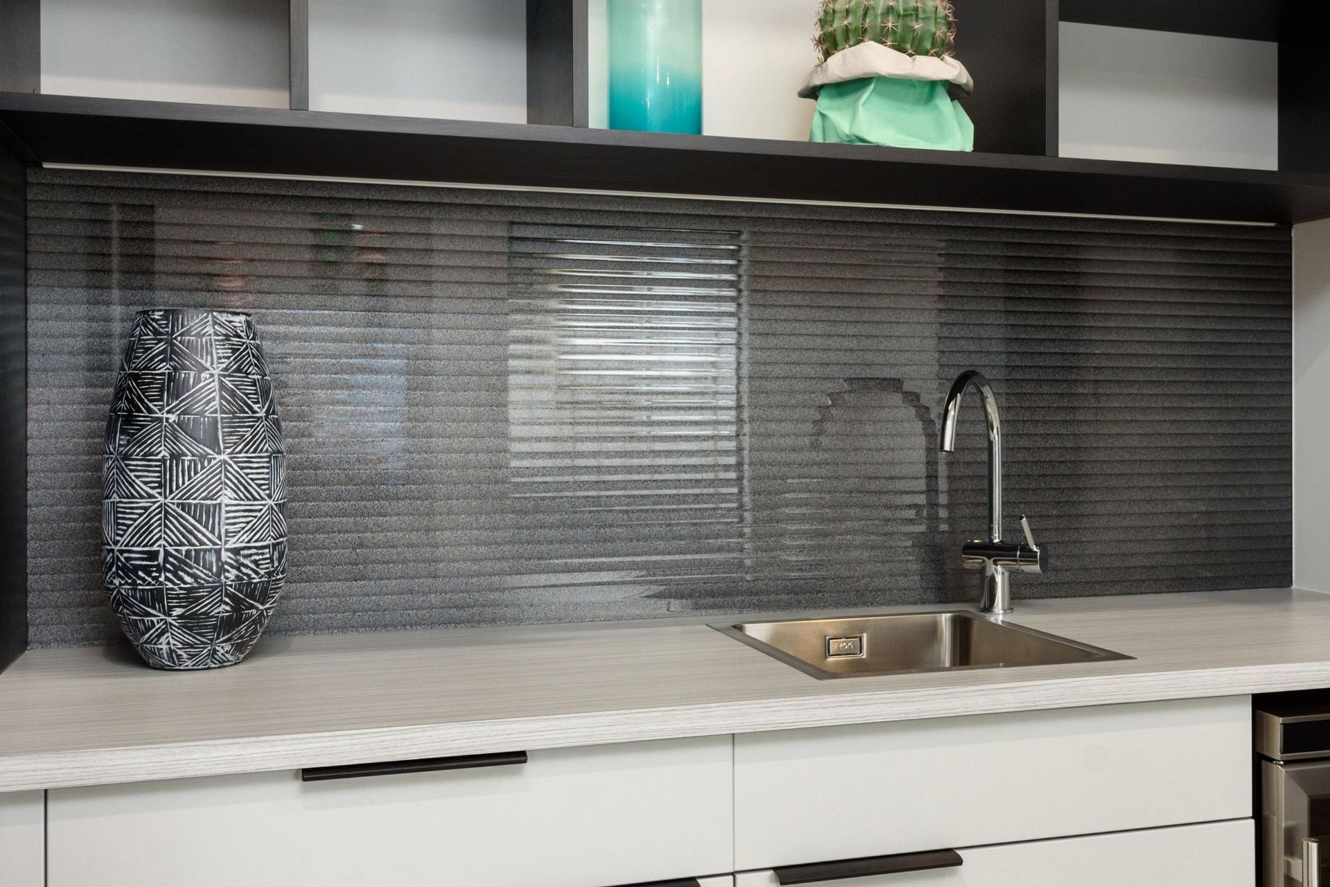 This narrow-reeded glass splashback from Glass Systems is the perfect example of how you can incorporate the feature into your kitchen.