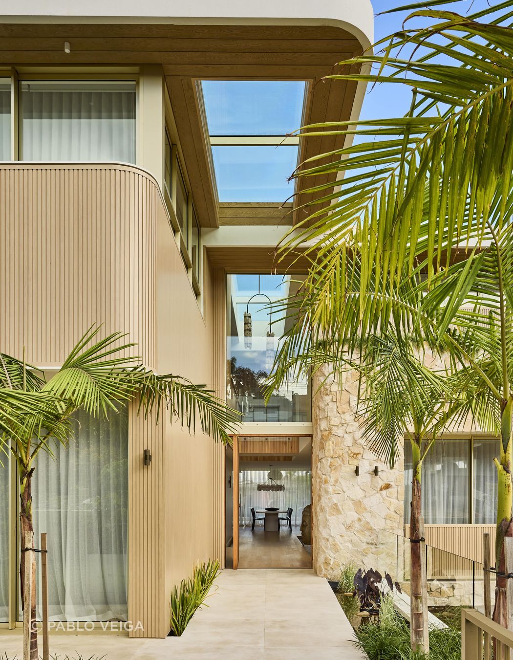 Wanderlust in Vaucluse by Conway & Wise. A coastal sanctuary inspired by Morocco, Santorini, and Los Angeles, featuring Crema Vialle Limestone flowing through the entry, balconies, and outdoor spaces. One of 2025's standout residential projects.