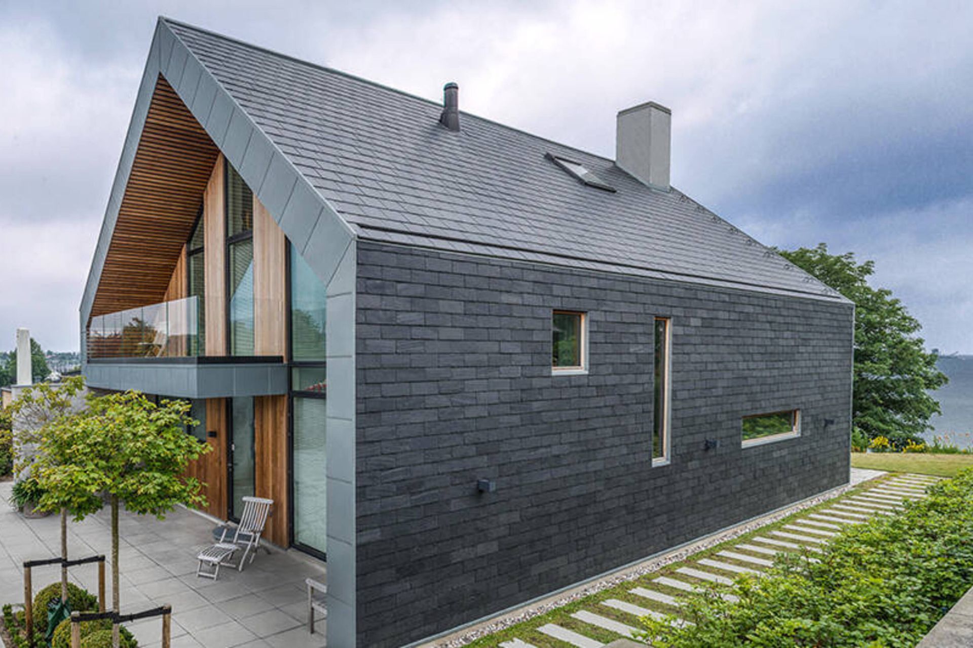 A new slate roof gives a home a unique finish.