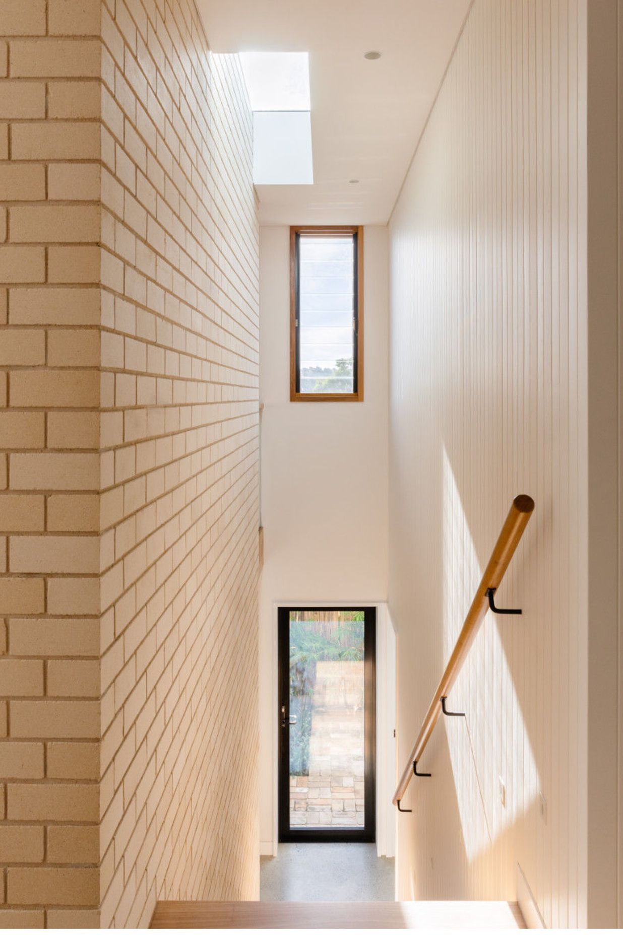 The light coloured bricks create a glow that is warm, yet gentle, and creates interest with texture.
