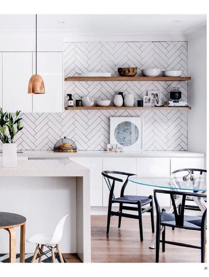 This kitchen features simple white subway tiles but the way they are installed is what actually adds a design element to an otherwise simple kitchen design. (Tile Depot 2021)