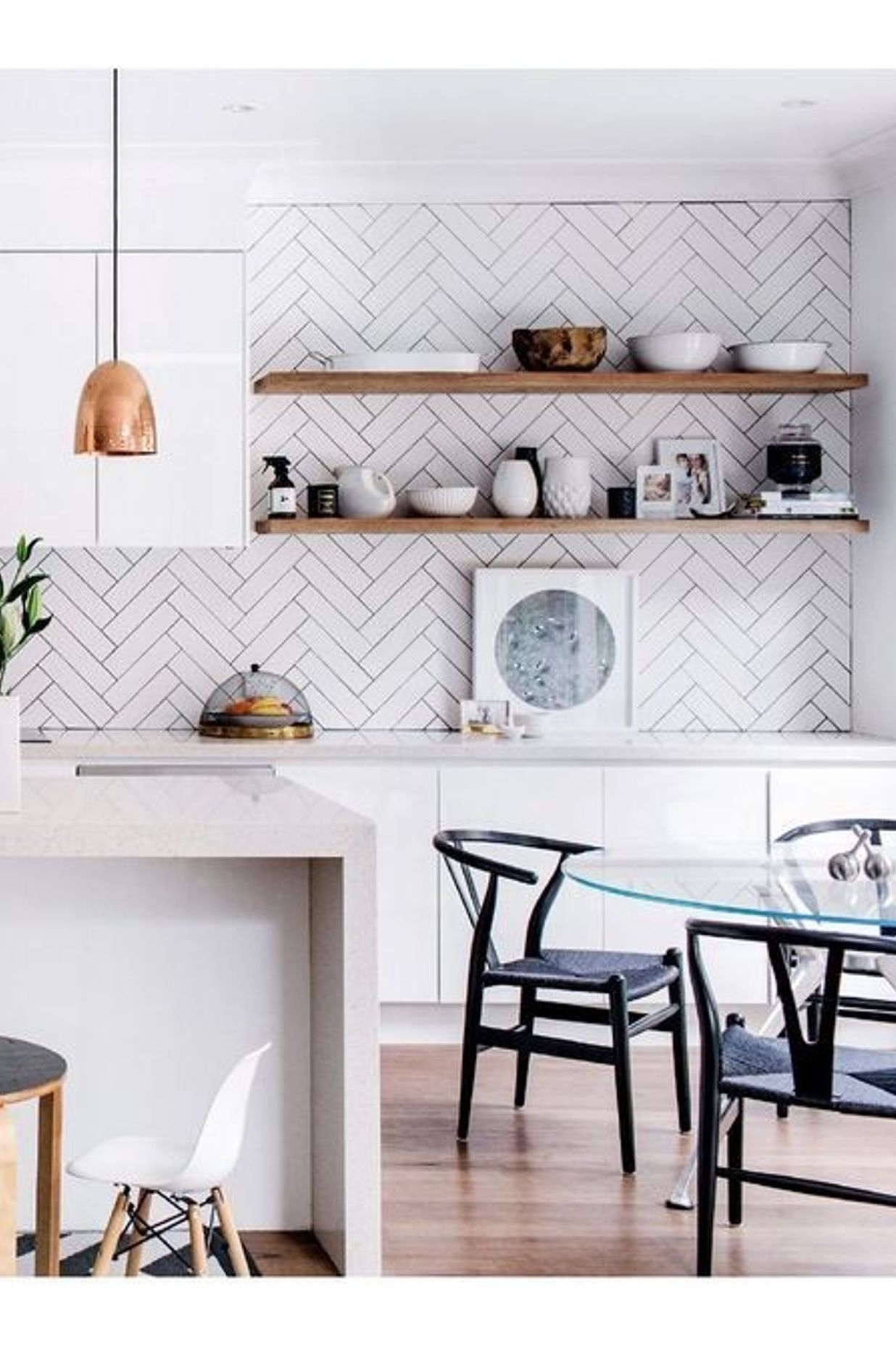 This kitchen features simple white subway tiles but the way they are installed is what actually adds a design element to an otherwise simple kitchen design. (Tile Depot 2021)