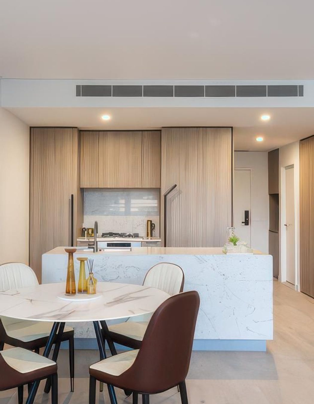 Expella tested and reported on range-hood performance prior to construction and installed Miele under-mount rangehoods in all of the kitchens at Natura. The under-mount range hood is concealed behind the kitchen joinery above the cook top.