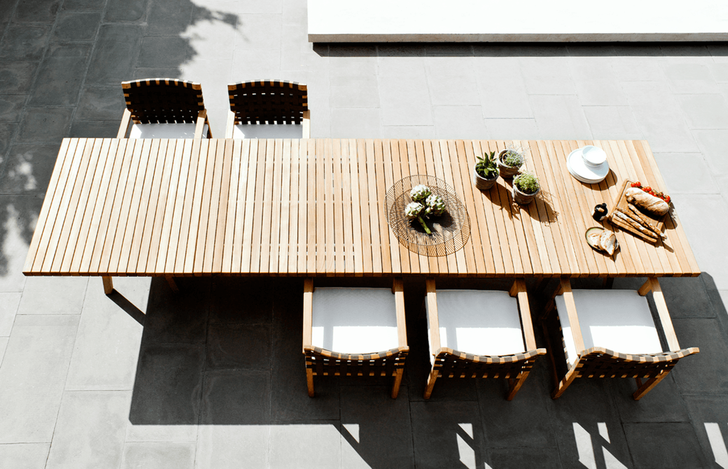 Pictured: Vis a Vis Dining Table by Tribu.