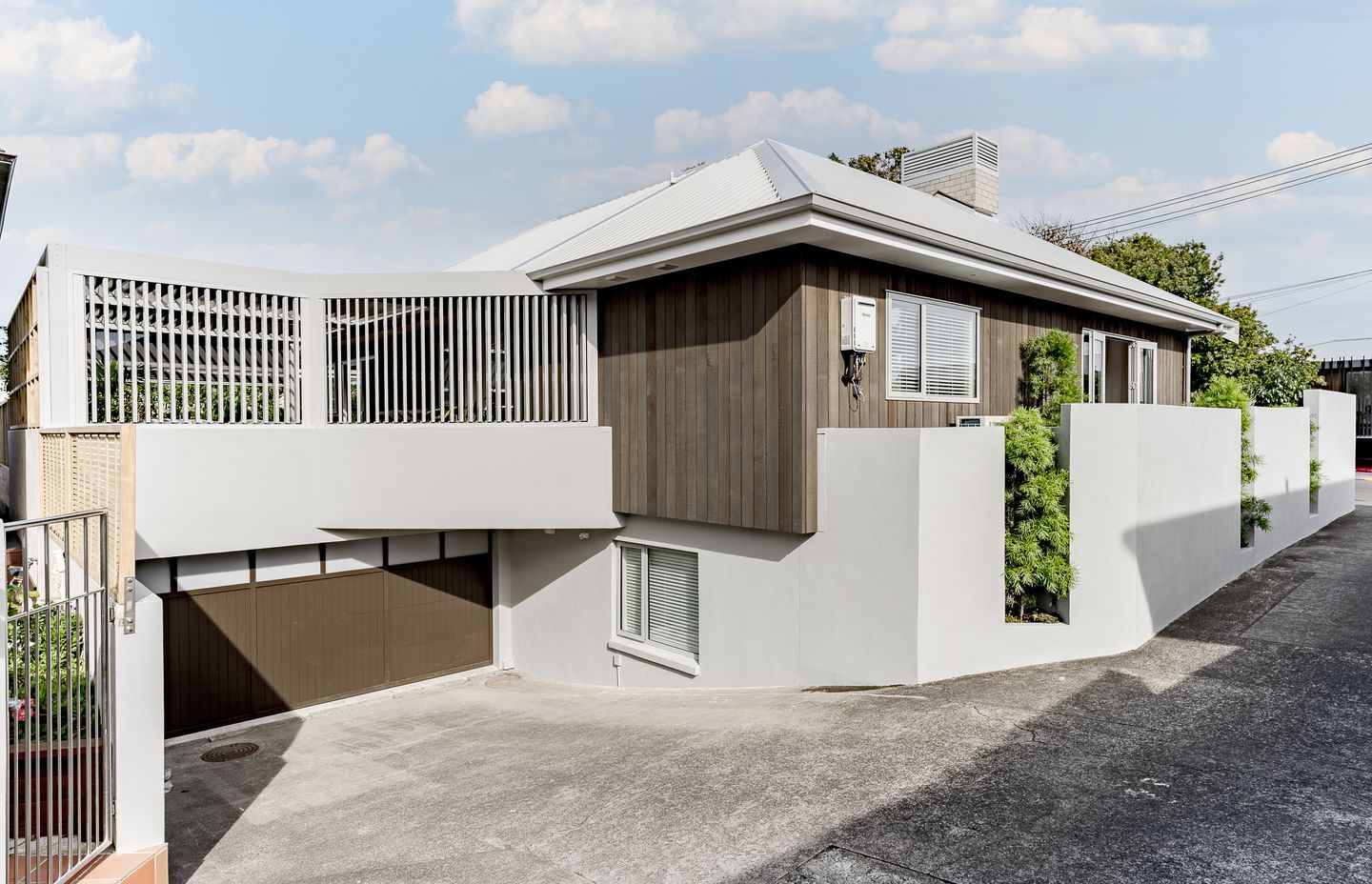 From the street the home appears single storey, but following the curve of the driveway you discover the ground floor below.