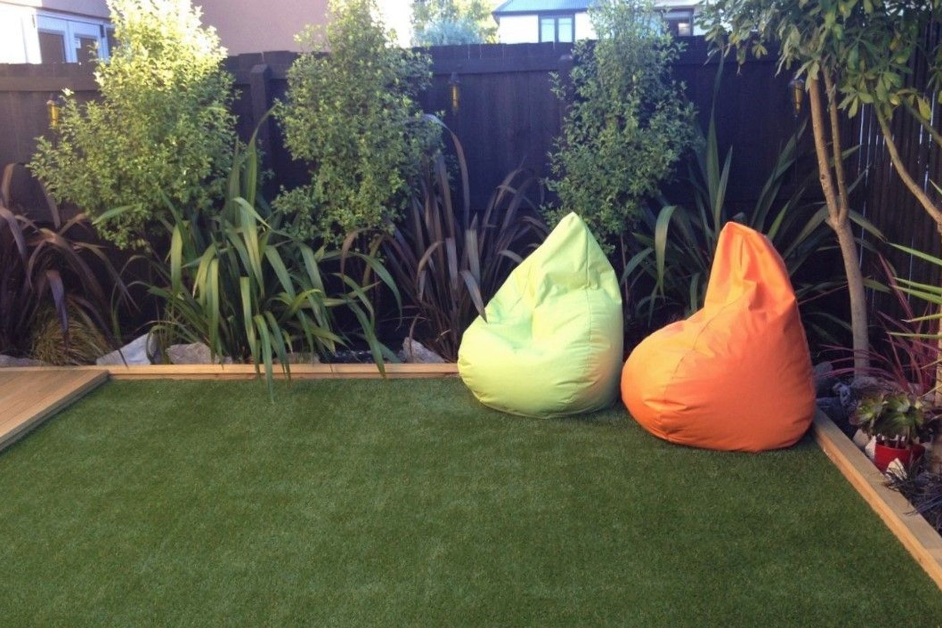 Artificial grass makes for a low-maintenance backyard.