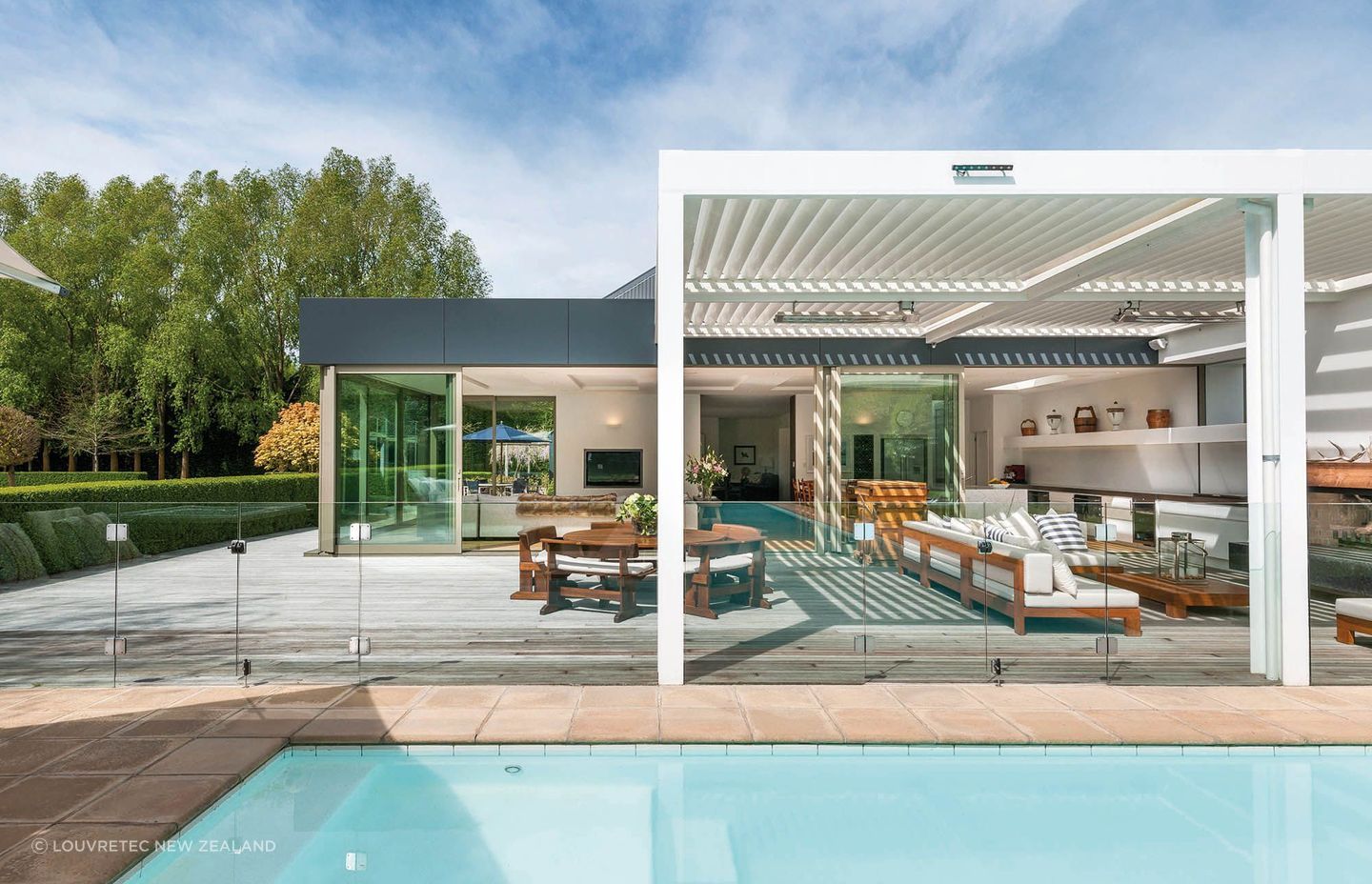 A beautiful outdoor space featuring Opening Louvre Roofs by Louvretec New Zealand.