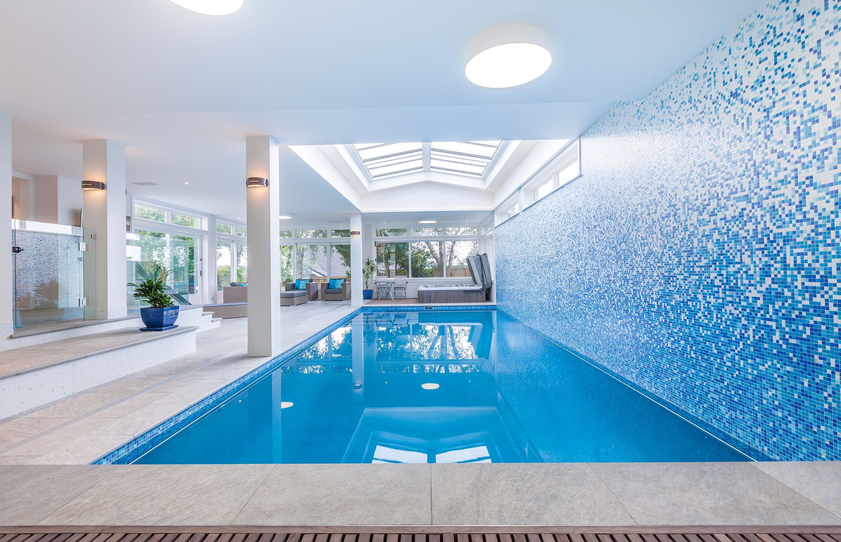 Indoor/outdoor pools are a way to ensure the pool area can be used in all seasons.