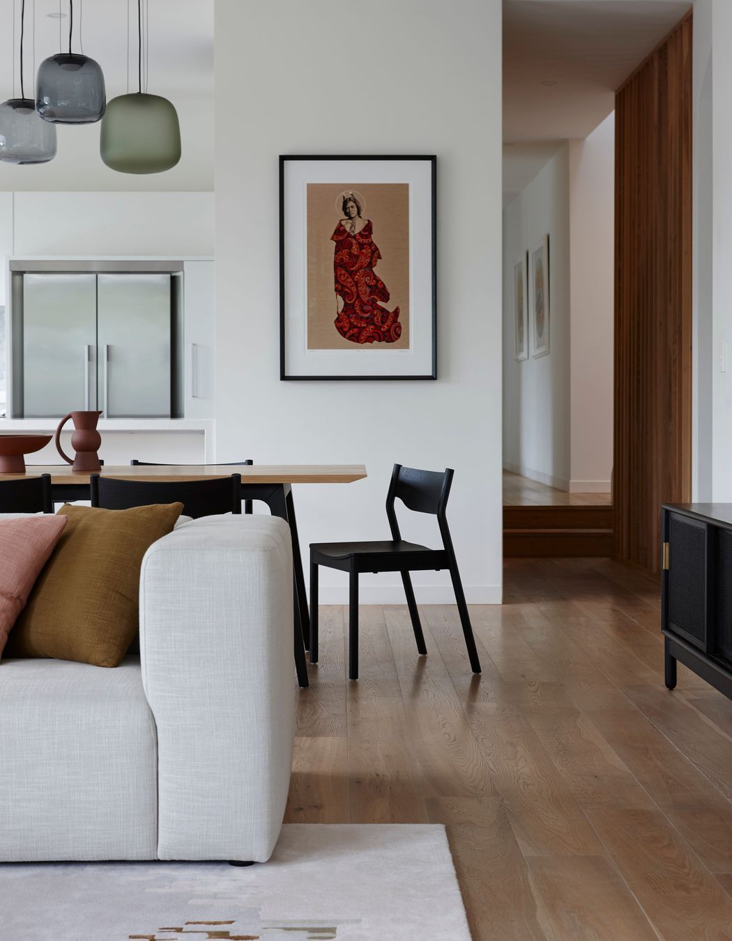 A Tim Webber lounge is a perfect base to the custom cushions and coloured light pendants from Città.