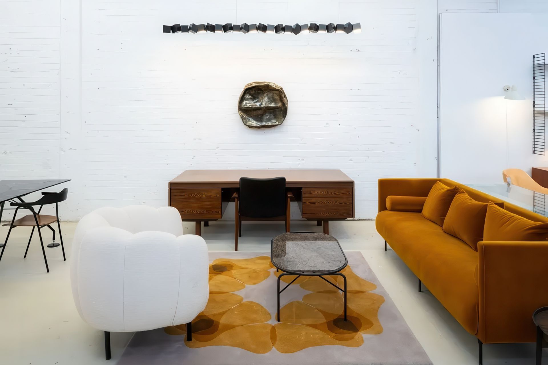 Warm Nordic lounge pieces featured with Quadriligia Rug by Chiara Corbeletto for Dilana, Blockchain Pendant from Oblure, vintage desk from Gordon Russell from Mr. Bigglesworthy and artwork by Monique Lacey from Foenander Galleries.