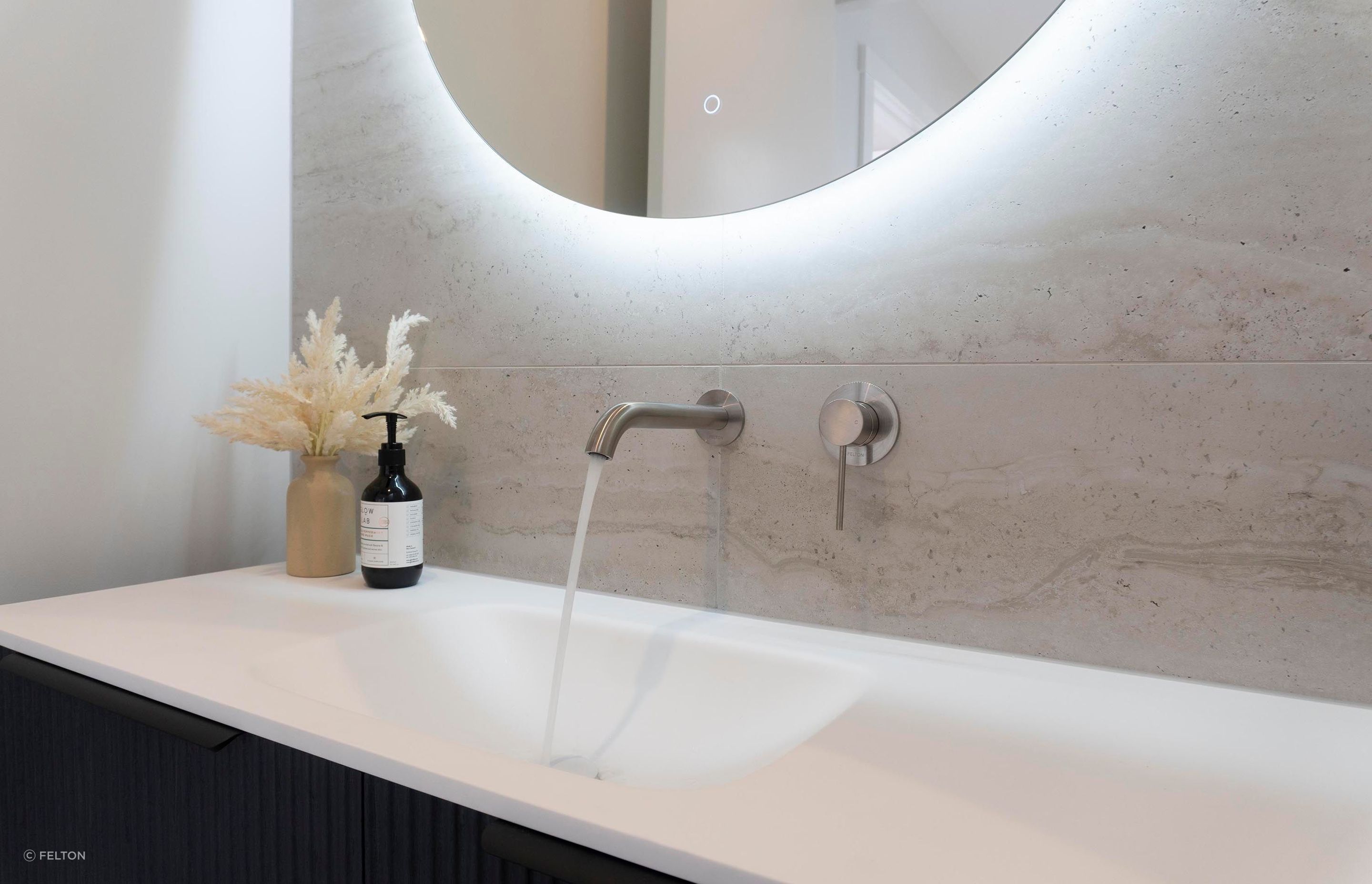 A finished Felton tap and mixer installed in a bathroom.