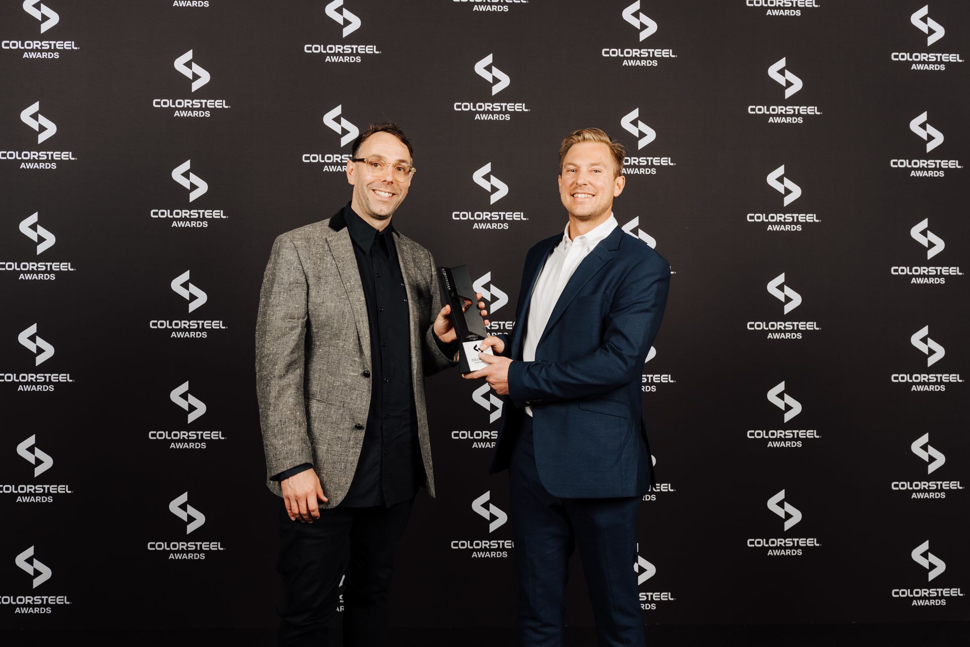 Thom Ibbotson and Camden Pyke from Yoke accept the COLORSTEEL award for Commercial Building of the Year.