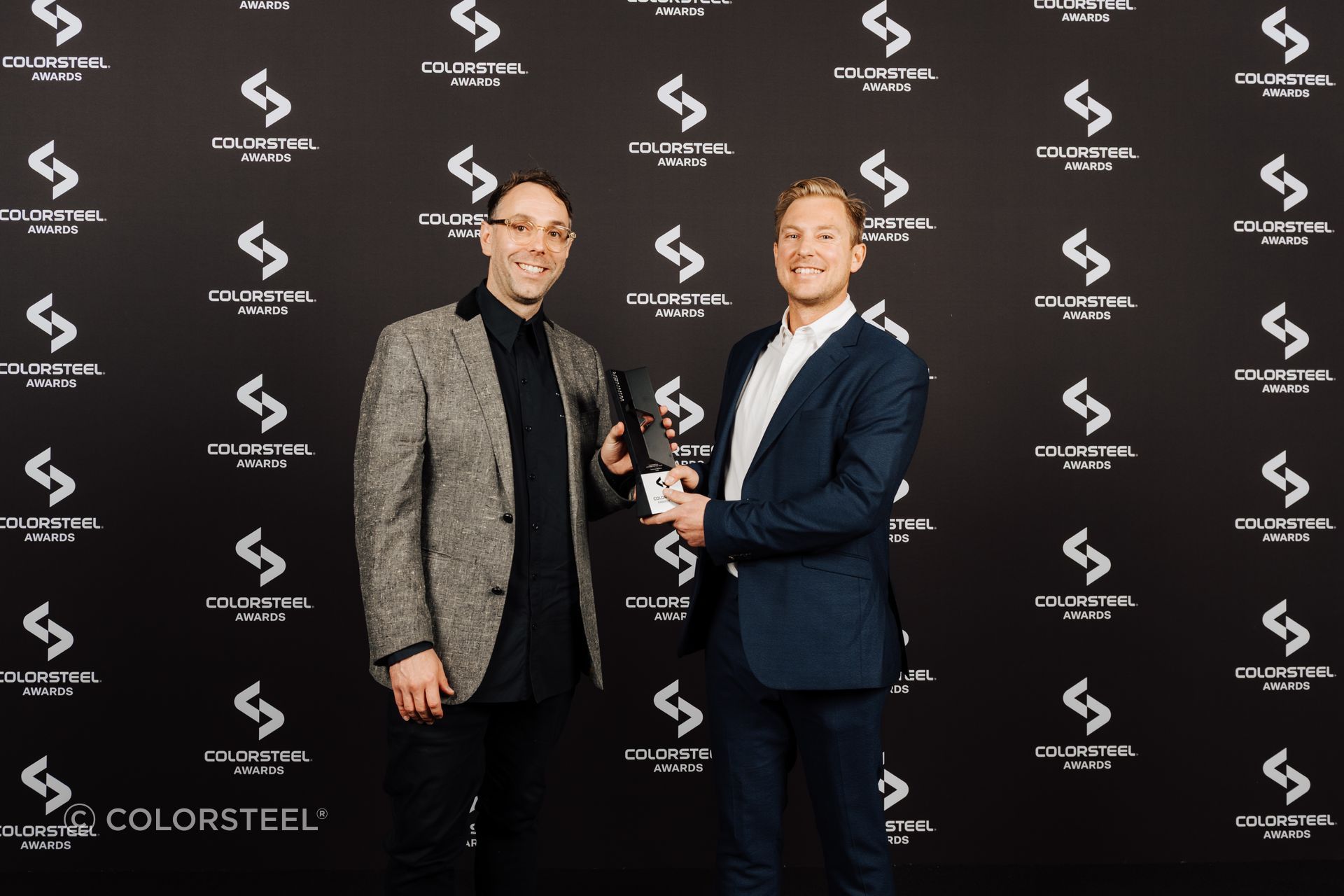 Thom Ibbotson and Camden Pyke from Yoke accept the COLORSTEEL award for Commercial Building of the Year.